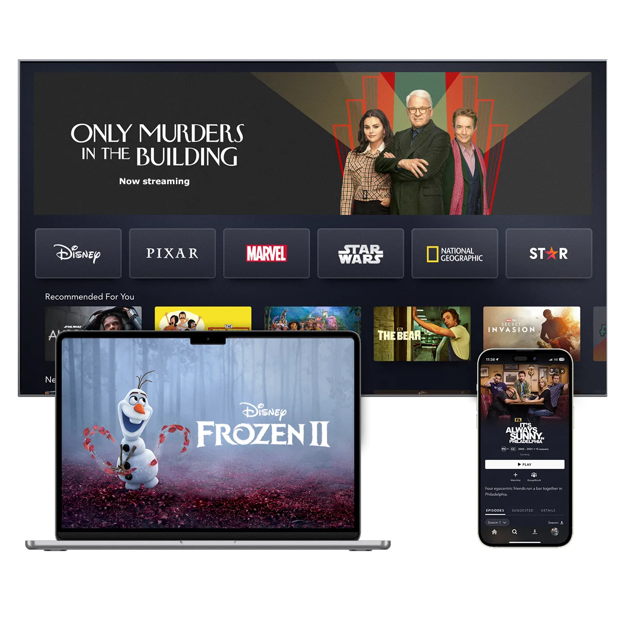 Disney+ available to stream on your TV, Laptop and mobile phones. This is an image of TV screen with the Disney+ UI screen with "Only Murderers in the Building", a laptop with "Frozen 2" and mobile phone with "It's Always Sunny in Philadelphia".